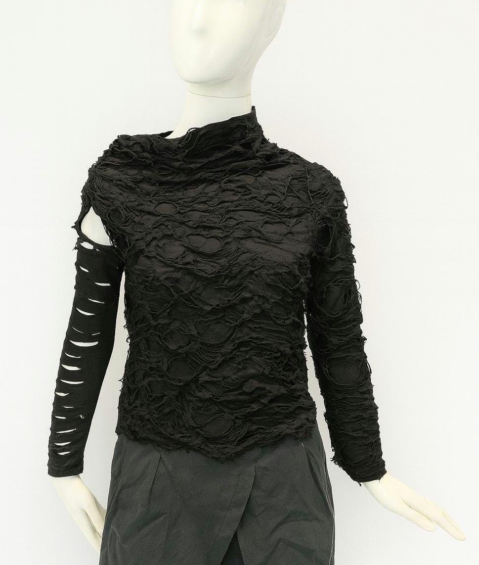 Afterrift Top — cyberpunk asymmetric black textured top with a slashed sleeve on a mannequin