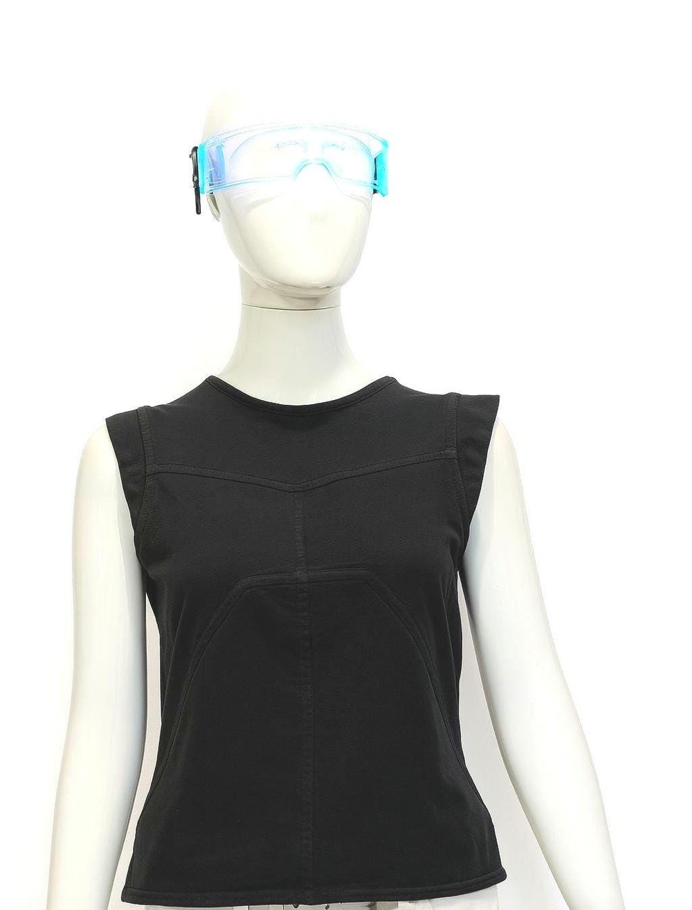 Blackout Exoshell — black futuristic sleeveless top on a mannequin, framed just below the top hem