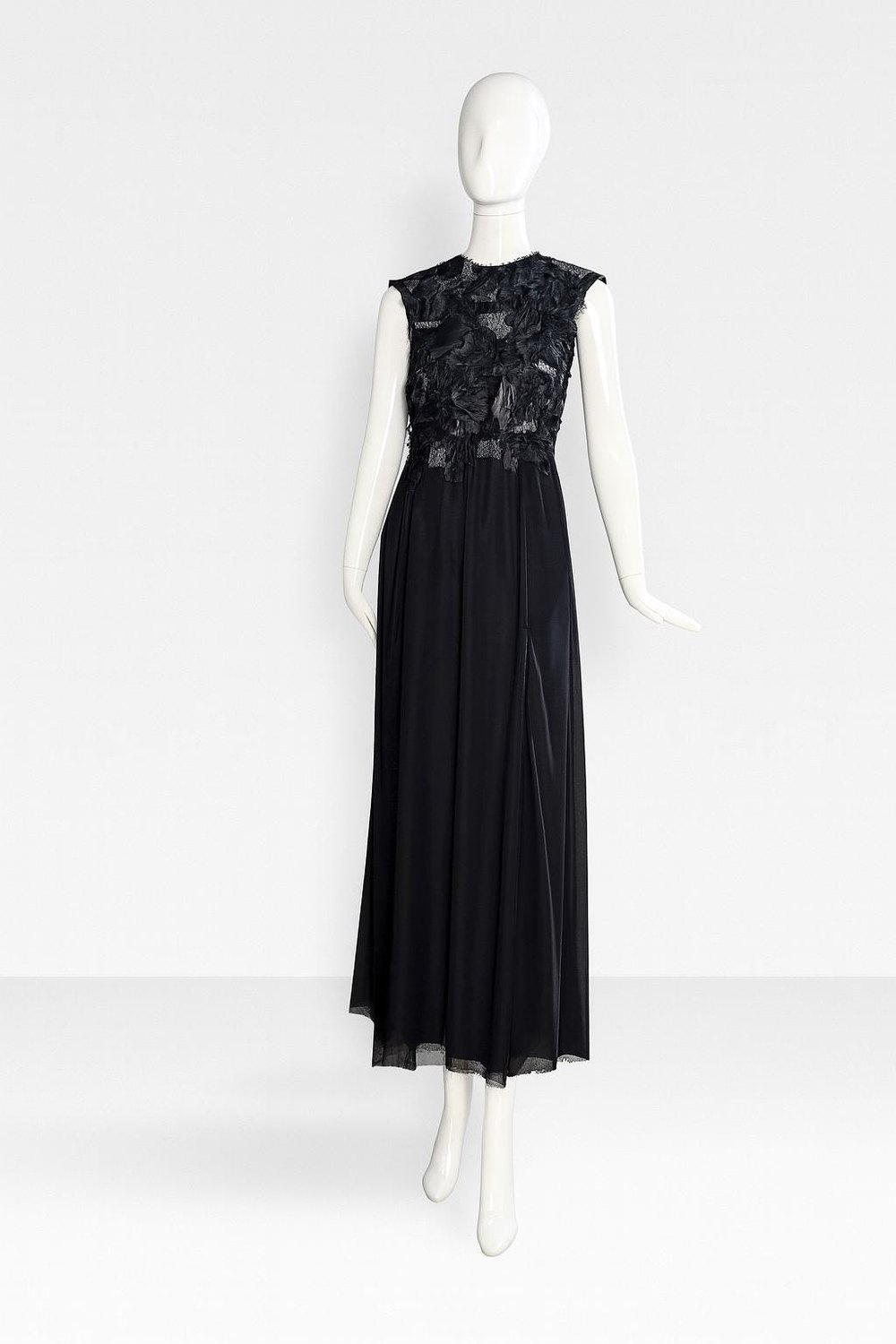 WhisperSuit — black futuristic evening gown with a textured bodice on a mannequin
